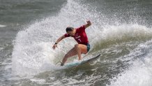 USA's Carissa Moore rides a wave during the women's Surfing Third round at the Tsurigasaki Surfing Beach, in Chiba, on July 26, 2021 during the Tokyo 2020 Olympic Games.