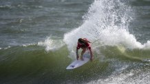 USA's Caroline Marks rides a wave during the women's Surfing Third round at the Tsurigasaki Surfing Beach, in Chiba, on July 26, 2021, during the Tokyo 2020 Olympic Games.