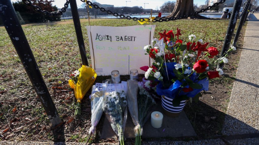 People place flowers and candles for Ashli Babbit, an Air Force veteran who was shot and killed in the U.S Capitol building yesterday was honored near the U.S Capitol building in Washington D.C., on January 07, 2020.