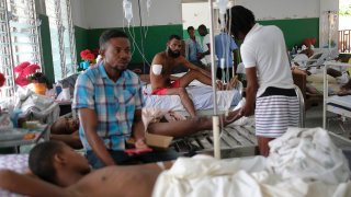 Felix Pierre Genel, 36, whose arm was amputated after he was injured in the earthquake, is treated at the Immaculate Conception Hospital