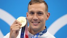 Gold medalist Caeleb Dressel of Team United States poses with the gold medal for the Men's 50m Freestyle Final on day nine of the Tokyo 2020 Olympic Games at Tokyo Aquatics Centre on August 1, 2021 in Tokyo, Japan.