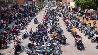 STURGIS, SOUTH DAKOTA - AUGUST 08: Motorcycle enthusiasts attend the 81st annual Sturgis Motorcycle Rally on August 8, 2021 in Sturgis, South Dakota. The rally is expect to draw more than 500,00 people during its 10-day run.