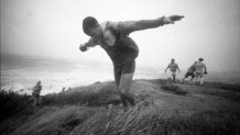 People play in the high winds of Hurricane Bob at Nobska Point in Woods Hole, Mass., on Aug. 19, 1991.