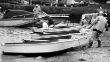 People pull their boats out of Hingham Harbor in Hingham, Mass., on Aug. 19, 1991, ahead of Hurricane Bob.