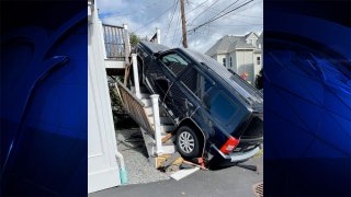 An SUV that crashed up a staircase in Waltham, Massachusetts