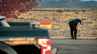 A distraught Alec Baldwin lingers in the parking lot outside the Santa Fe County Sheriff’s Office in Santa Fe, N.M., after he was questioned about a shooting on the set of the film “Rust” on the outskirts of Santa Fe, Thursday, Oct. 21, 2021.