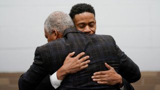 Aretha Franklin's sons Kecalf Franklin, rear, hugs Edward Franklin after a ceremony honoring Aretha Franklin, Monday, Oct. 4, 2021, in Detroit. Franklin was given a bit of R-E-S-P-E-C-T when a post office in her hometown of Detroit was named after the late singer. Members of Franklin's family as well as postal and elected officials visited the former Fox Creek post office to celebrate the name change honoring the Queen of Soul.