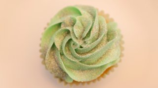 Overhead view of a cupcake decorated with edible glitter.
