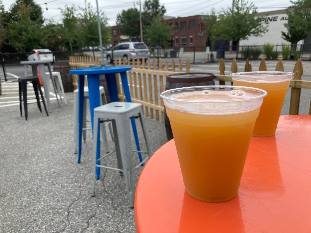 Two beers on the patio at Providence's Beer on Earth