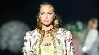 Lila Grace Moss walks the runway at a Versace special event during Milan Fashion Week on Sept. 26, 2021.