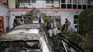Afghans inspect damage of Ahmadi family house
