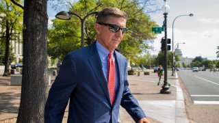 FILE - In this Sept. 10, 2019 file photo, Michael Flynn, President Donald Trump's former national security adviser, leaves the federal court following a status conference in Washington. The arrest of President Donald Trump’s former chief strategist Steve Bannon adds to a growing list of Trump associates ensnared in legal trouble. They include the president's former campaign chair, Paul Manafort, whom Bannon replaced, his longtime lawyer, Michael Cohen, and his former national security adviser, Michael Flynn.