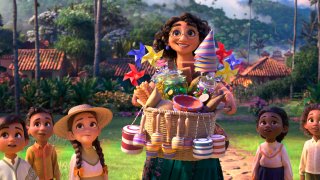 This image released by Disney shows Mirabel, voiced by Stephanie Beatriz, in a scene from the animated film "Encanto."