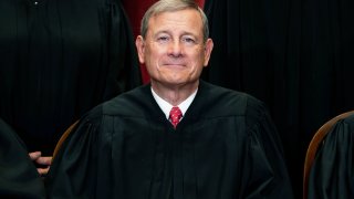 FILE - In this April 23, 2021, file photo Chief Justice John Roberts sits during a group photo at the Supreme Court in Washington. The Supreme Court on Friday rejected a plea from South Carolina to reimpose the death penalty on a South Carolina inmate whose death sentence stood for two decades until a federal appeals court threw it out in August. Chief Justice John Roberts did not comment in denying the state's request to stop the clock on a lower court order in favor of inmate Sammie Lee Stokes.