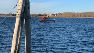 A boat searching Narragansett Bay for a woman who fell off a ferry.