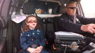 Olivia Gant rides with Captain Tim Scudder after Denver police made her an officer for a day.