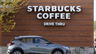 A customers exits the drive thru lane at a Starbucks coffee shop, Tuesday, April 27, 2021, in Des Moines, Iowa. After four straight quarters of sales declines, Starbucks returned to growth in the January-March period.