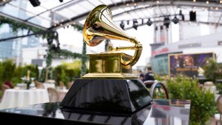 FILE - A decorative grammy is seen before the start of the 63rd annual Grammy Awards on March 14, 2021 in Los Angeles. The 2022 Grammy Awards will shift to an April show in Las Vegas after recently postponing the ceremony due to growing concerns with the rise of the omicron variant. The awards will be broadcast live from the MGM Grand Garden Arena on April 3, according to a joint statement released Tuesday, Jan. 18, 2022, from the Recording Academy and CBS, which broadcast the ceremony.