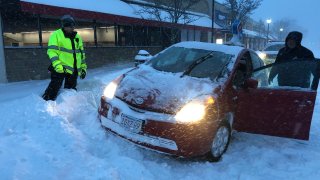 Pizza delivery car stuck in a snowbank