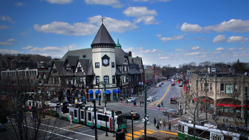 The S.S. Pierce Building presides over the intersection of Beacon and Harvard Streets in the Coolidge Corner neighborhood of Brookline, Massachusetts, as MBTA Green Line trains make their way to and from Cleveland Circle on April 11, 2018.