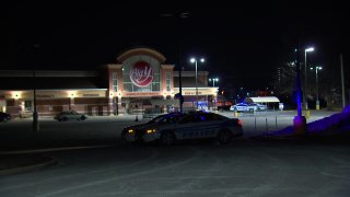 Police at the scene of a deadly shooting in the parking lot of a Worcester Big Y store on Saturday, Jan. 15, 2022.