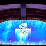 Dancers perform as an image is projected inside the National Stadium prior to the start of the opening ceremony of the 2022 Winter Olympics, Friday, Feb. 4, 2022, in Beijing.