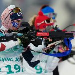 Clare Egan of Team United States shoots during the 4x6-kilometer mixed relay at the 2022 Winter Olympics, Saturday, Feb. 5, 2022, in Zhangjiakou, China.