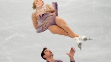 Alexa Knierim and Brandon Frazier, of the United States, compete in the pairs team free skate program during the figure skating competition at the 2022 Winter Olympics, Monday, Feb. 7, 2022, in Beijing.