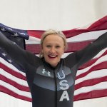 Kaillie Humphries, of the United States, celebrates winning the gold medal in the Women's Monobob at the 2022 Winter Olympics,Feb. 14, 2022, in the Yanqing district of Beijing, China.