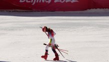 Mikaela Shiffrin of the United States leaves the finish area after racing in a semifinal of the Mixed Team Parallel Skiing event at the 2022 Winter Olympics, Feb. 20, 2022, in the Yanqing district of Beijing, China.
