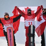 From left: silver medallist China's Su Yiming, gold medallist Canada's Max Parrot and bronze medallist Canada's Mark McMorris pose on the podium after the Snowboard Men's Slopestyle final run during the 2022 Winter Olympics at the Genting Snow Park H & S Stadium in Zhangjiakou, China on Feb. 7, 2022.