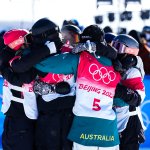 Competitors for the women's snowboard slopestyle gather for a celebratory group hug at Genting Snow Park on Feb. 6, 2022, in Zhangjiakou, China. New Zealand won their first ever gold at the event, with the US breaking their medal-less streak with Julia Marino's silver.