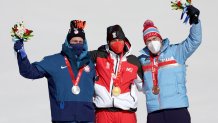 Gold medallist Matthias Mayer of Team Austria (C), Silver medallist Ryan Cochran-Siegle of Team United States (L) and Bronze medalist Aleksander Aamodt Kilde of Team Norway (R) pose during the Men's Super-G medal ceremony on day four of the 2022 Winter Olympics at National Alpine Ski Centre on Feb. 8, 2022, in Yanqing, China.