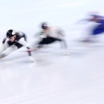 Kristen Santos of Team United States, Petra Jaszapati of Team Hungary and Cynthia Mascitto of Team Italy compete during the women's 1000m heats at the 2022 Winter Olympics, Feb. 9, 2022, in Beijing, China.