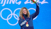 Gold medallist Lindsey Jacobellis of Team United States celebrates during the Women's Snowboard Cross medal ceremony at the 2022 Winter Olympic Games, Feb. 9, 2022, in Zhangjiakou, China.