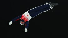Justin Schoenefeld of Team United States in air during the Freestyle Skiing Mixed Team Aerials on Day 6 Beijing 2022 Winter Olympics Day of the at Genting Snow Park, Feb. 10, 2022 in Zhangjiakou, China. The US will advance to the team aerials final.