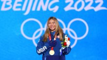 Chloe Kim of Team United States celebrates with her gold medal at the Women's Snowboard Halfpipe medal ceremony at the 2022 Winter Olympic Games, Beijing Medal Plaza, Feb. 10, 2022 in Beijing, China.