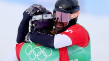 Lindsey Jacobellis of Team United States (L) and Nick Baumgartner of Team United States (R) celebrate winning the gold medal during the Snowboard Mixed Team Cross Big Final on day 8 of the 2022 Winter Olympics at Genting Snow Park on Feb. 12, 2022, in Zhangjiakou, China.