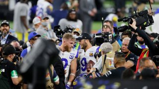 Cooper Kupp #10 of the Los Angeles Rams and Matthew Stafford #9 of the Los Angeles Rams celebrate after Super Bowl LVI at SoFi Stadium on February 13, 2022 in Inglewood, California. The Los Angeles Rams defeated the Cincinnati Bengals 23-20.