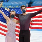 Bronze medalists Madison Hubbell and Zachary Donohue of Team United States celebrate during the Ice Dance Free Dance flower ceremony on day 10 of the 2022 Winter Olympics at Capital Indoor Stadium on Feb. 14, 2022, in Beijing, China.