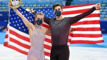 Bronze medalists Madison Hubbell and Zachary Donohue of Team United States celebrate during the Ice Dance Free Dance flower ceremony on day 10 of the 2022 Winter Olympics at Capital Indoor Stadium on Feb. 14, 2022, in Beijing, China.
