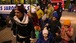 Refugees from Ukraine arrive at a temporary shelter on Feb. 28, 2022, near Korczowa, Poland.
