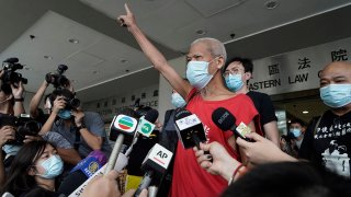 FILE - Hong Kong activist Koo Sze-yiu speaks to the media after arriving at a court in Hong Kong, Sept. 30, 2020.