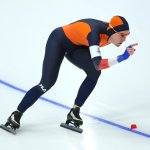 Ireen Wust of Team Netherlands skates on the way to setting a new Olympic record time