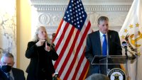 Rhode Island Gov. Dan McKee speaks at a COVID briefing