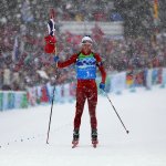 Ole Einar Bjoerndalen of Norway crosses the finish line to win the gold medal in the men's 4 x 7.5 km biathlon relay