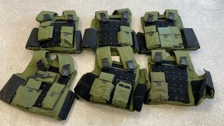 green and black body armor vests