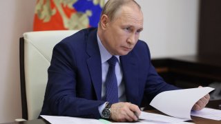 Russian President Vladimir Putin chairs a meeting on the road construction development via a video link at the Novo-Ogaryovo state residence, outside Moscow, on June 2, 2022.