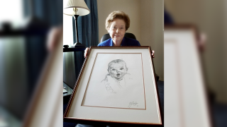 FILE – Ann Taylor Cook, poses at her Tampa, Fla., home Wednesday afternoon Feb. 4, 2004, with a copy of her photo that is used on all Gerber baby food products.