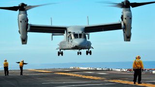 File - A U.S. Marine Corps MV-22 Osprey aircraft prepares to land on the flight deck of amphibious assault ship USS Makin Island in the Pacific Ocean on March 1, 2011.